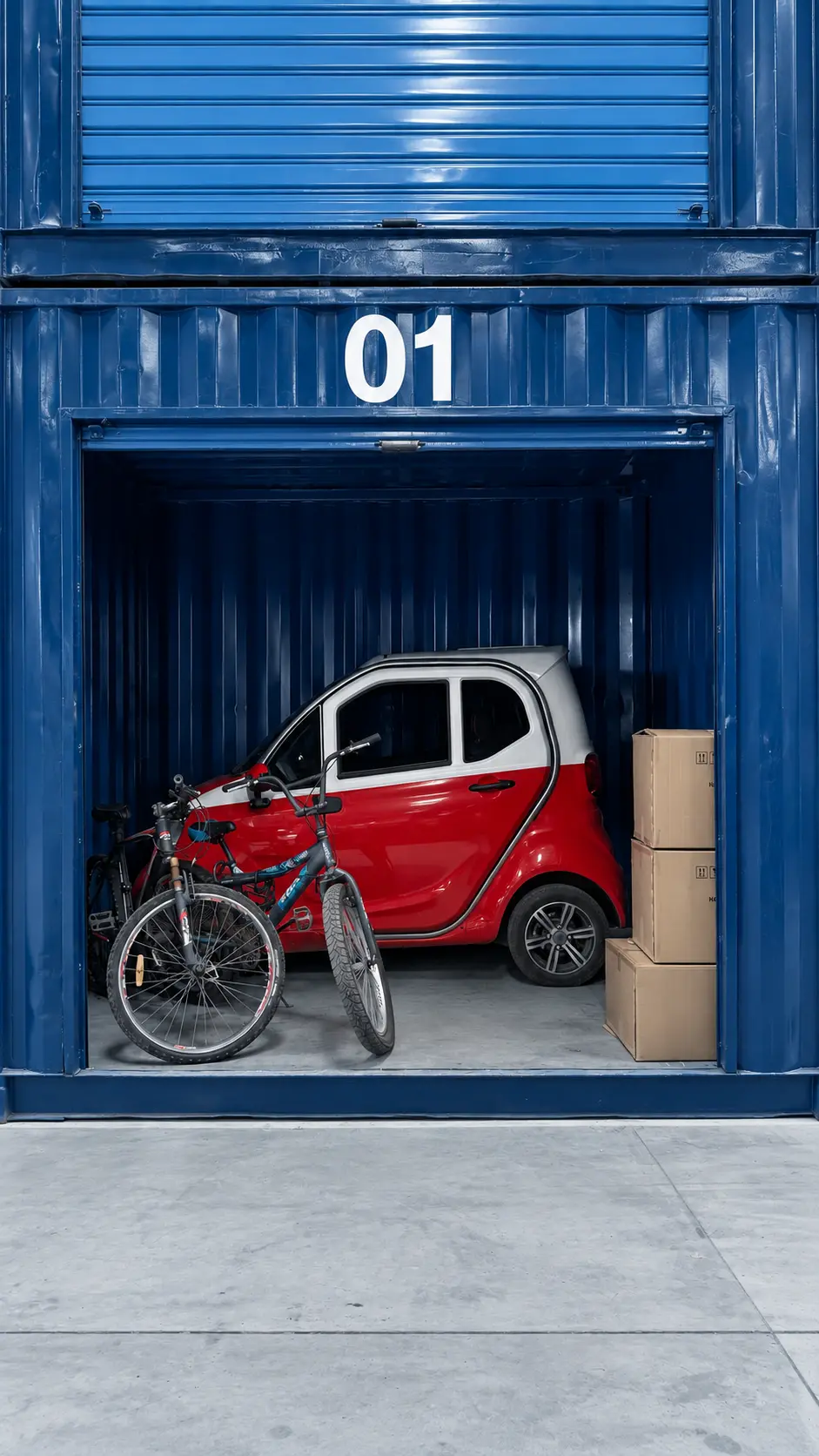 A car parked alongside stacked boxes inside a 20m³ storage unit
